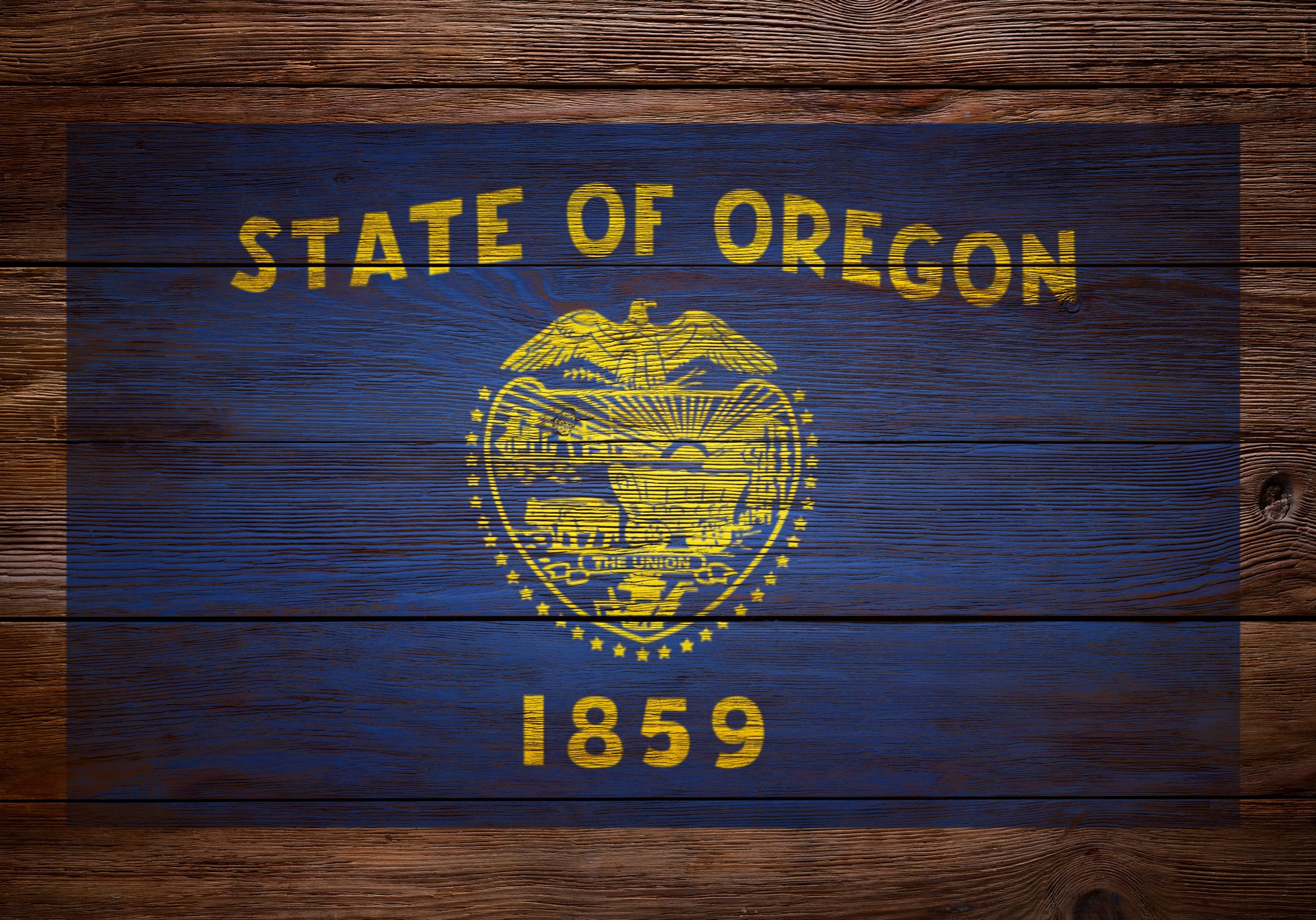 Flag of Oregon stenciled on wood